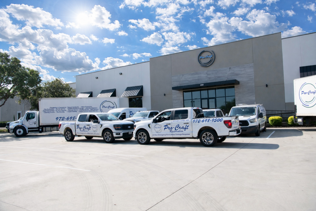 Pro-Craft Restoration service vehicles parked outside the company facility.